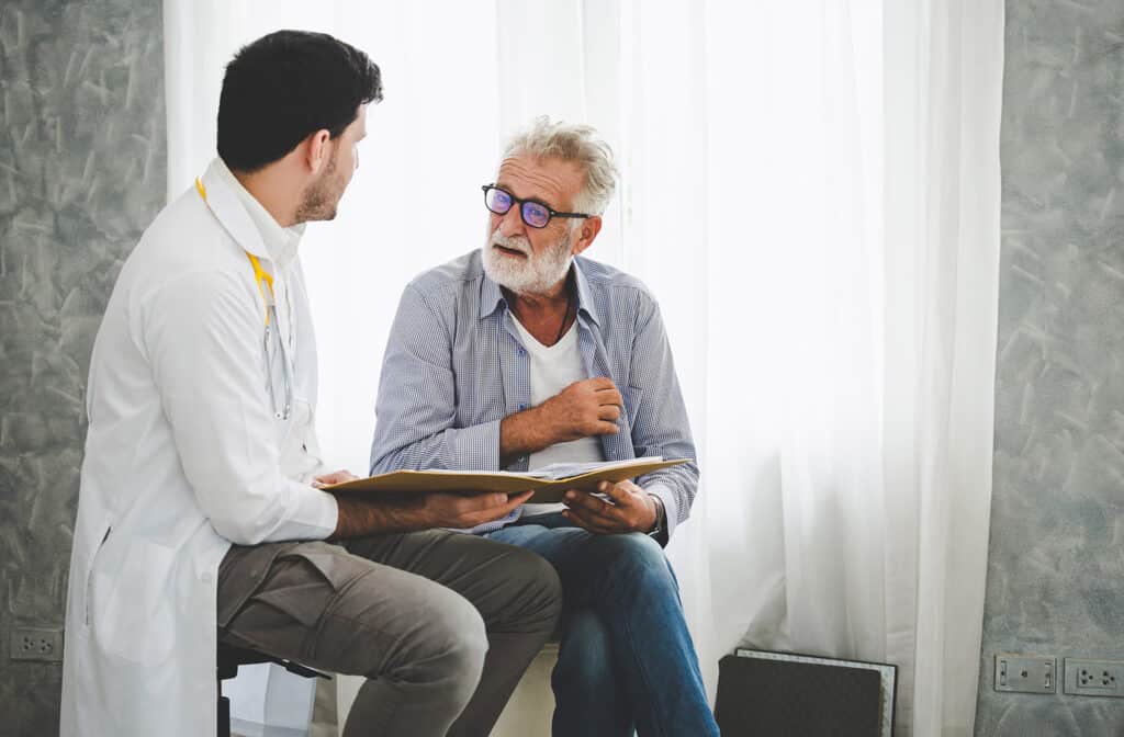 Professional psychologist doctor discussing with patient in therapy sessions at hospital room, Medical and Behavioral Health concept